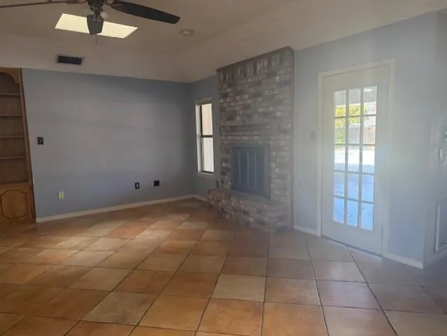 a view of an empty room with windows