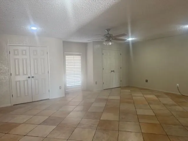wooden floor in an empty room with a bathroom