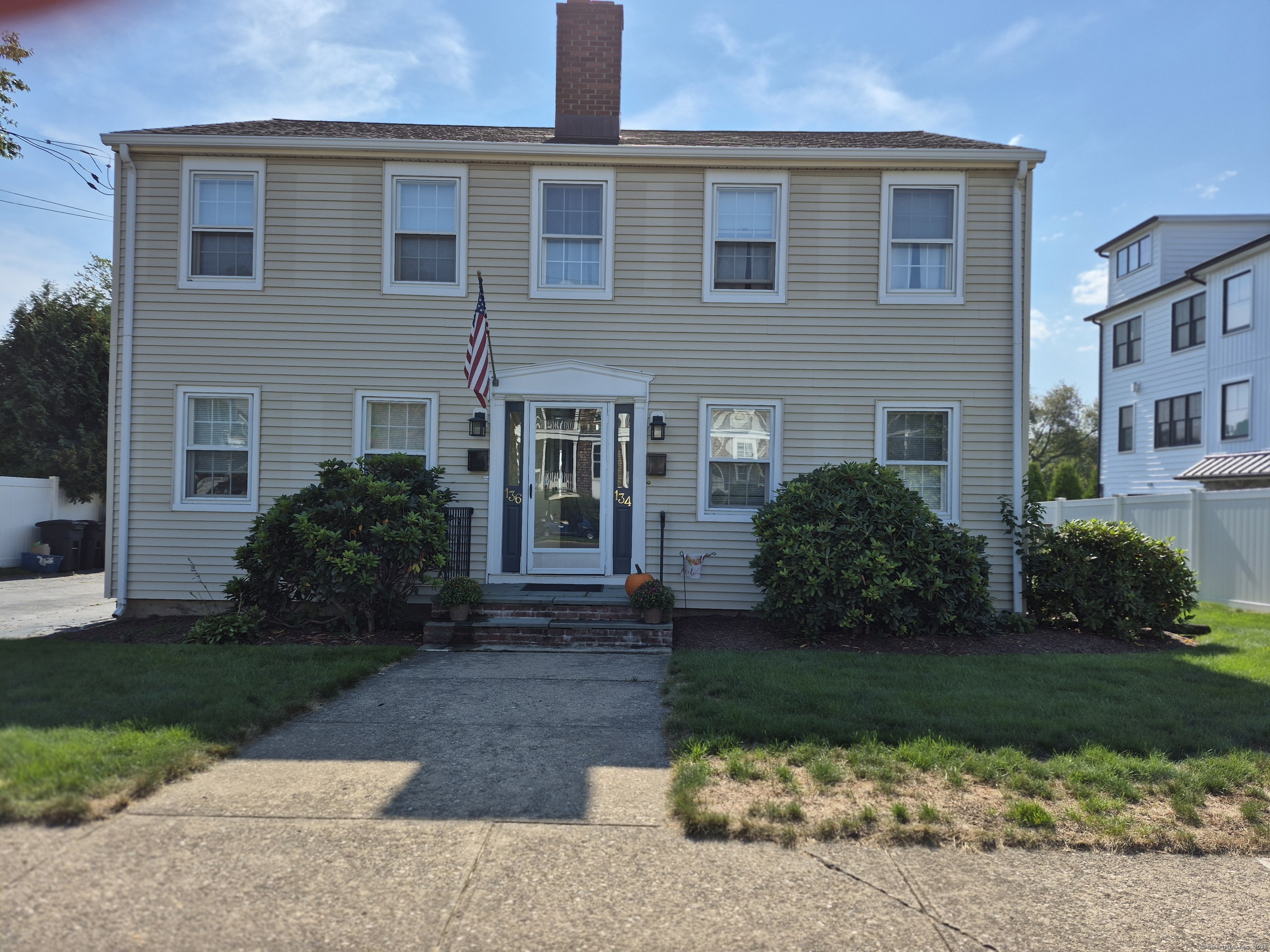 136 Fox Street Fairfield, CT 06824 - Photo 1 of 1 a front view of a house with garden