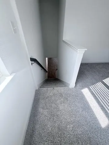 a view of an empty room and entryway