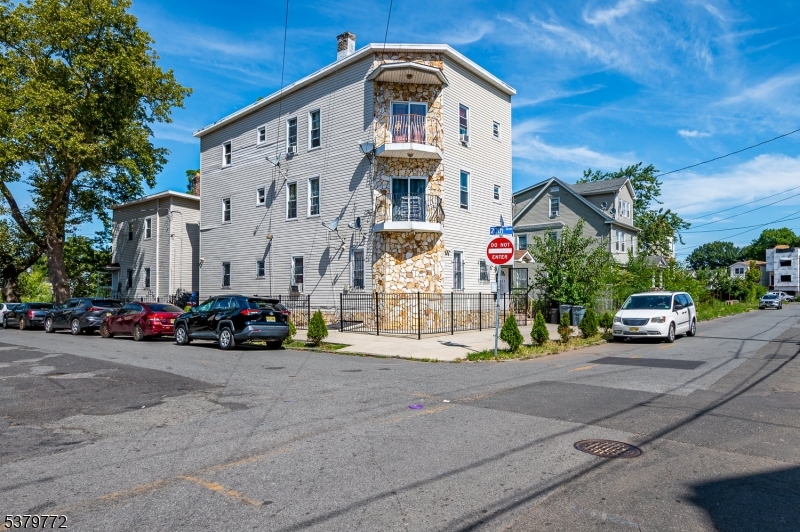 a view of a car park in front of a house