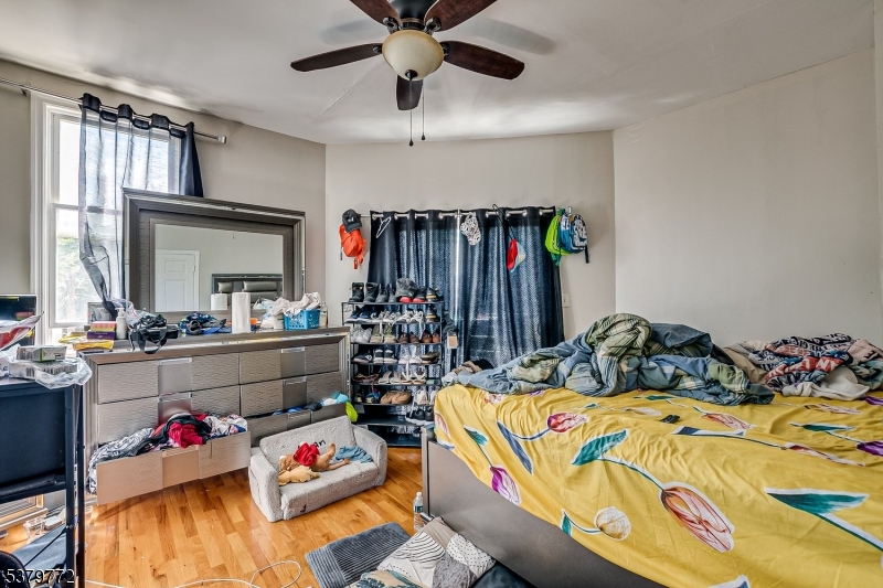 369 21st Street Irvington, NJ 07111 - Photo 12 of 16 a bedroom with furniture and a bed