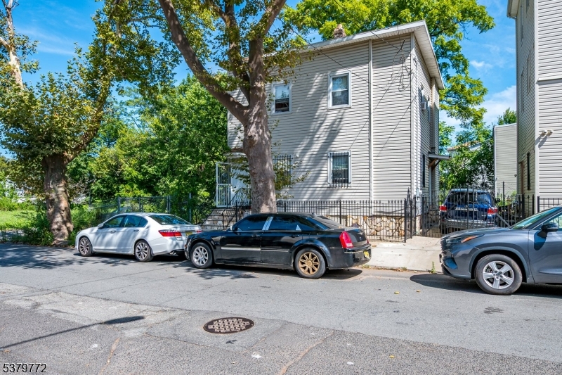 369 21st Street Irvington, NJ 07111 - Photo 14 of 16 a car parked in front of a house