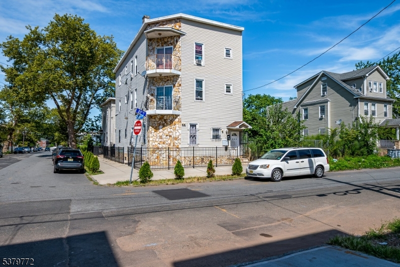 369 21st Street Irvington, NJ 07111 - Photo 3 of 16 a view of street with parked cars