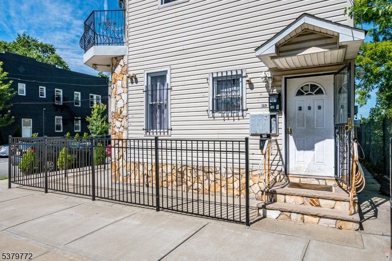 369 21st Street Irvington, NJ 07111 - Photo 4 of 16 a view of a house with a iron gate