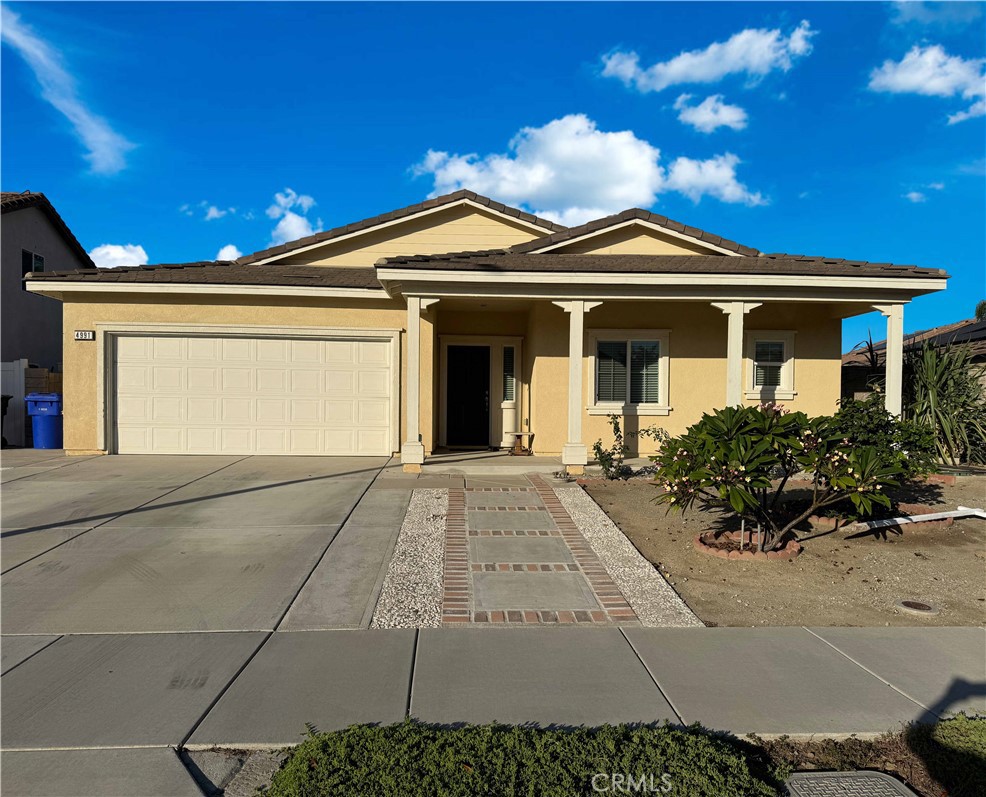 4991 Graphite Crk Road Jurupa Valley, CA 91752 - Photo 1 of 1 a front view of a house with garden