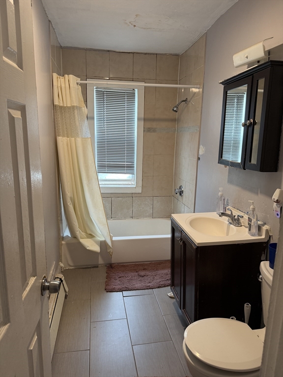 8 Ogden Street Boston, MA 02124 - Photo 9 of 20 a bathroom with a sink toilet and tub
