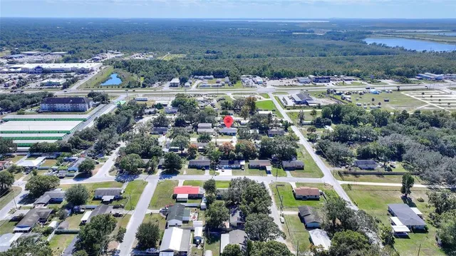 an aerial view of a residential houses and city street