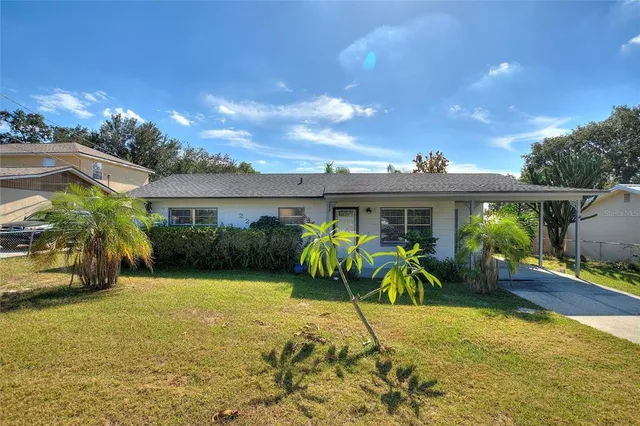 a view of a house with a yard