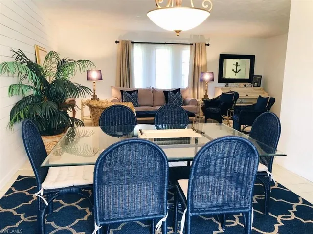 a view of a dining room with furniture and window