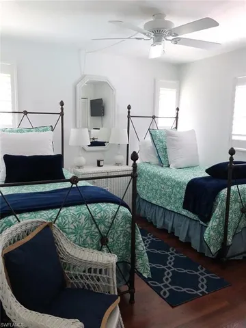a living room with a bed furniture and a window