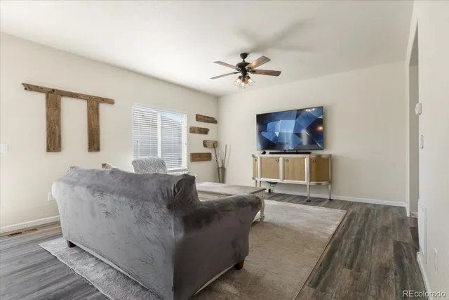 a living room with furniture and a rug