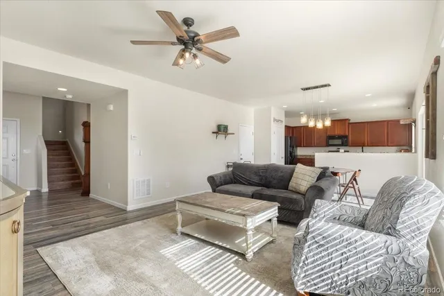 a living room with furniture and a rug