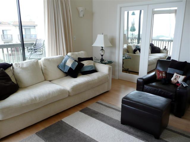 3375 Foothill Road, Unit 631 Carpinteria, CA 93013 - Photo 4 of 7 a living room with furniture and a large window