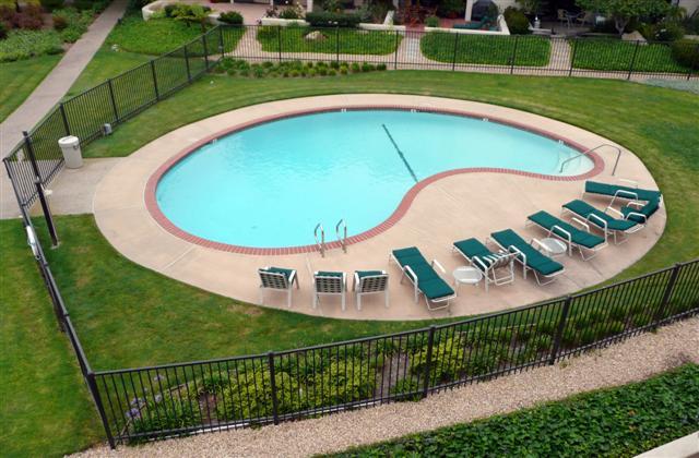 3375 Foothill Road, Unit 631 Carpinteria, CA 93013 - Photo 6 of 7 a view of a swimming pool with a garden and deck