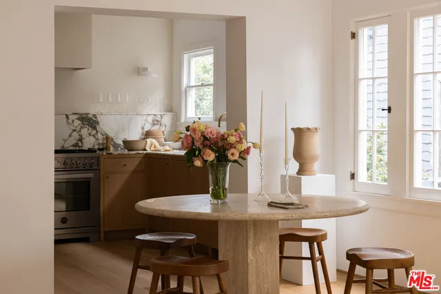 a dining room with furniture and window