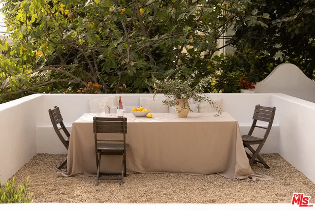 a view of an outdoor sitting area with furniture