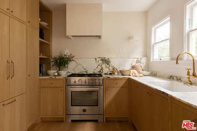 a kitchen with a stove and a sink