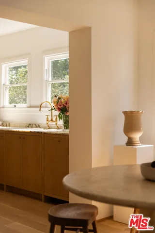 a room with wooden floor and a window