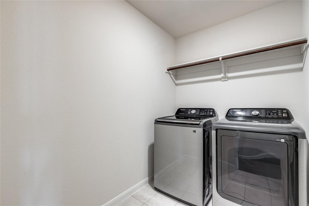 504 Stampede Lane Princeton, TX 75407 - Photo 10 of 13 a view of storage and utility room with washer and dryer
