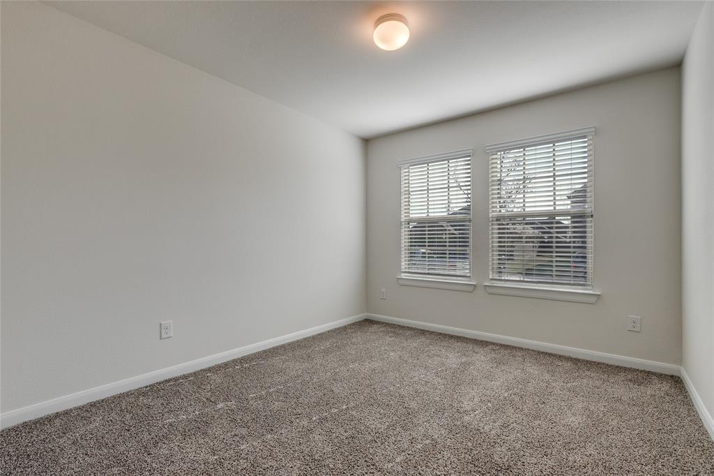 504 Stampede Lane Princeton, TX 75407 - Photo 2 of 13 an empty room with a window