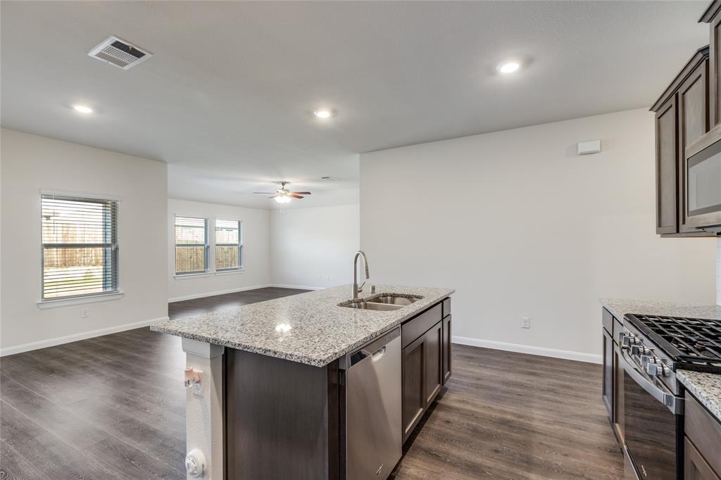 504 Stampede Lane Princeton, TX 75407 - Photo 13 of 13 an empty room with wooden floor and windows