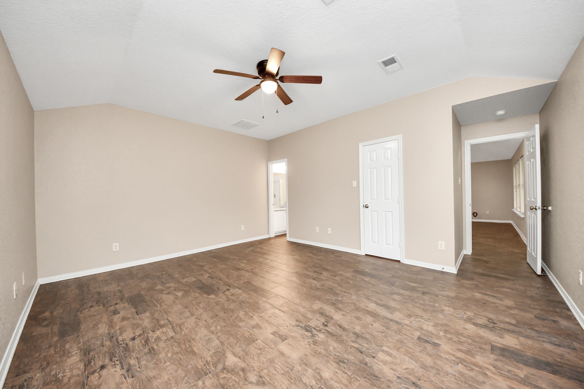 14610 Hazy Ridge Lane Cypress, TX 77429 - Photo 22 of 44 Relax and unwind in the expansive primary suite, thoughtfully designed for comfort, privacy, and everyday living.