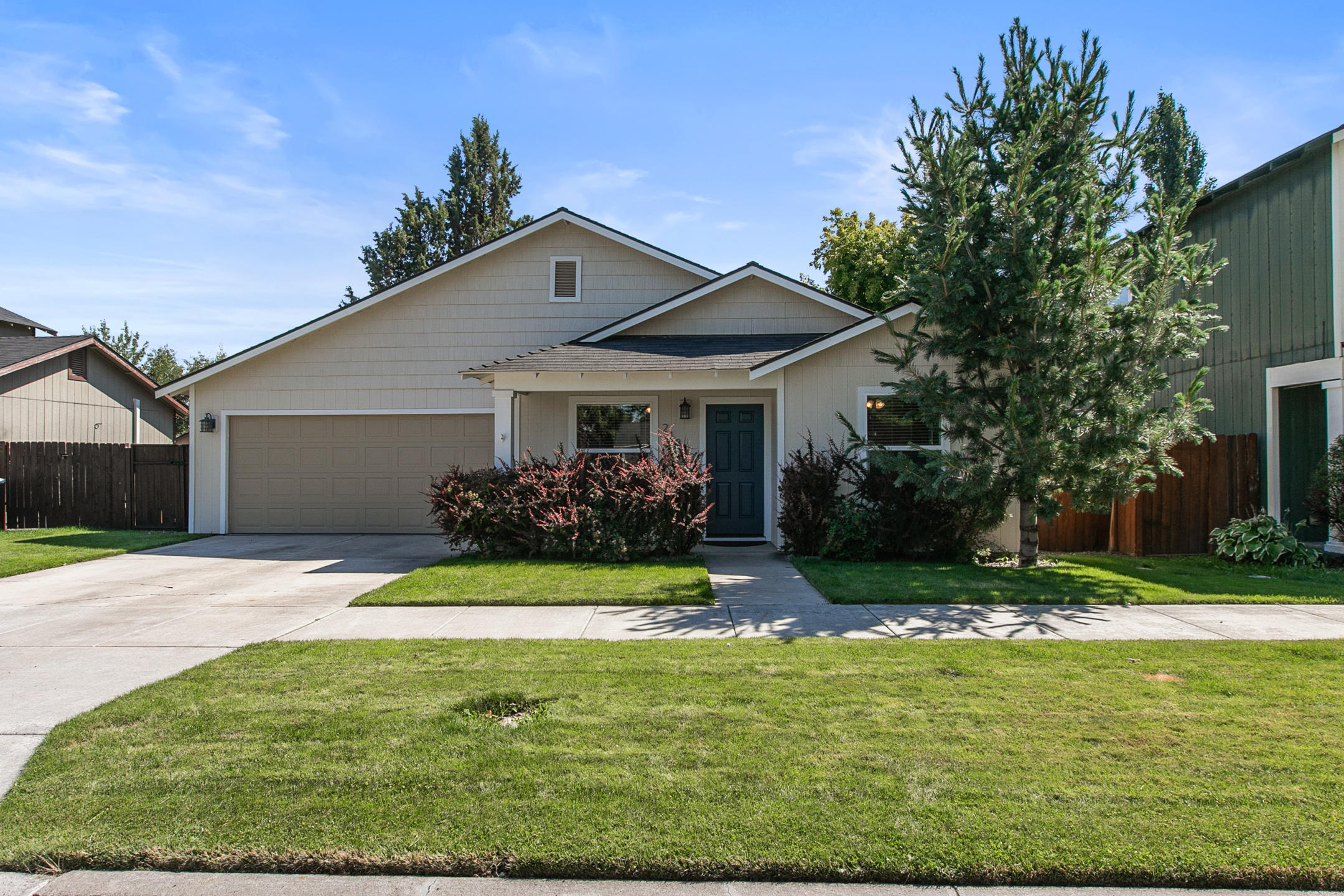 21363 Pecoraro Loop Bend, OR 97701 - Photo 1 of 15 a front view of a house with a yard