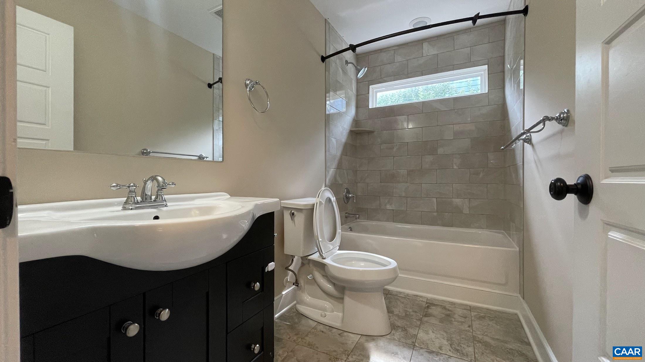 200 Harris Road Charlottesville, VA 22903 - Photo 17 of 28 a bathroom with a sink toilet and shower
