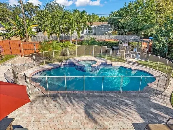 a view of swimming pool with a patio
