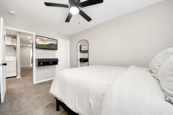 a bedroom with a bed and a cabinets