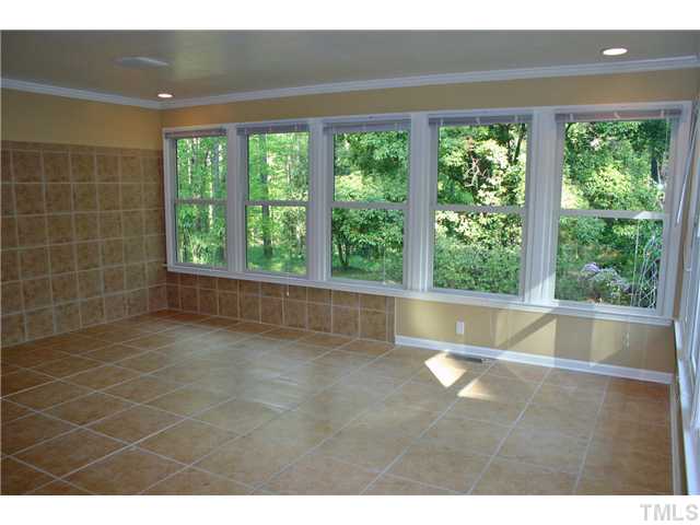 3936 Hope Valley Road Durham, NC 27707 - Photo 5 of 10 The updated sunroom has tile floor and windows overlooking the private backyard.