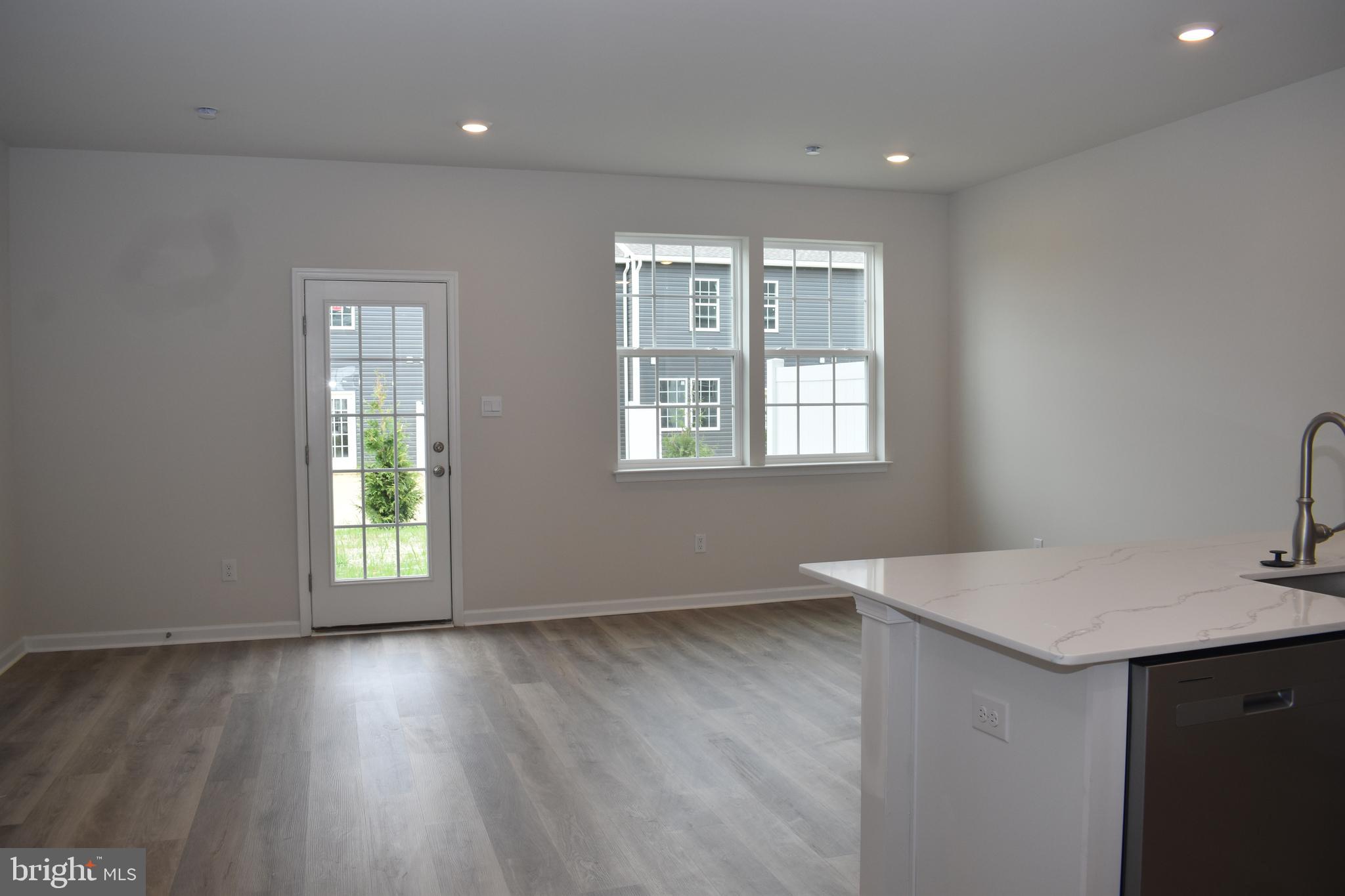80 Alexander Way Westampton, NJ 08060 - Photo 22 of 45 a view of an empty room with wooden floor and a window