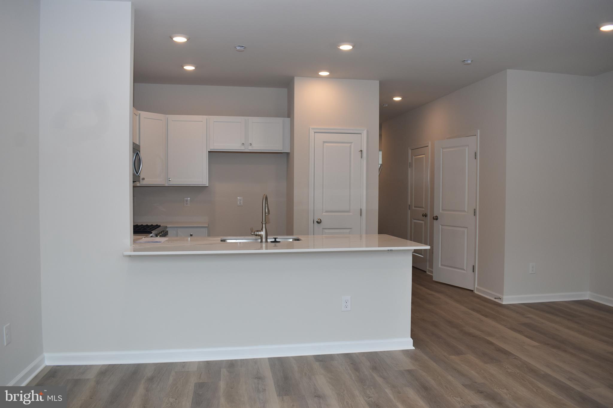 80 Alexander Way Westampton, NJ 08060 - Photo 24 of 45 a kitchen with stainless steel appliances a sink and a refrigerator