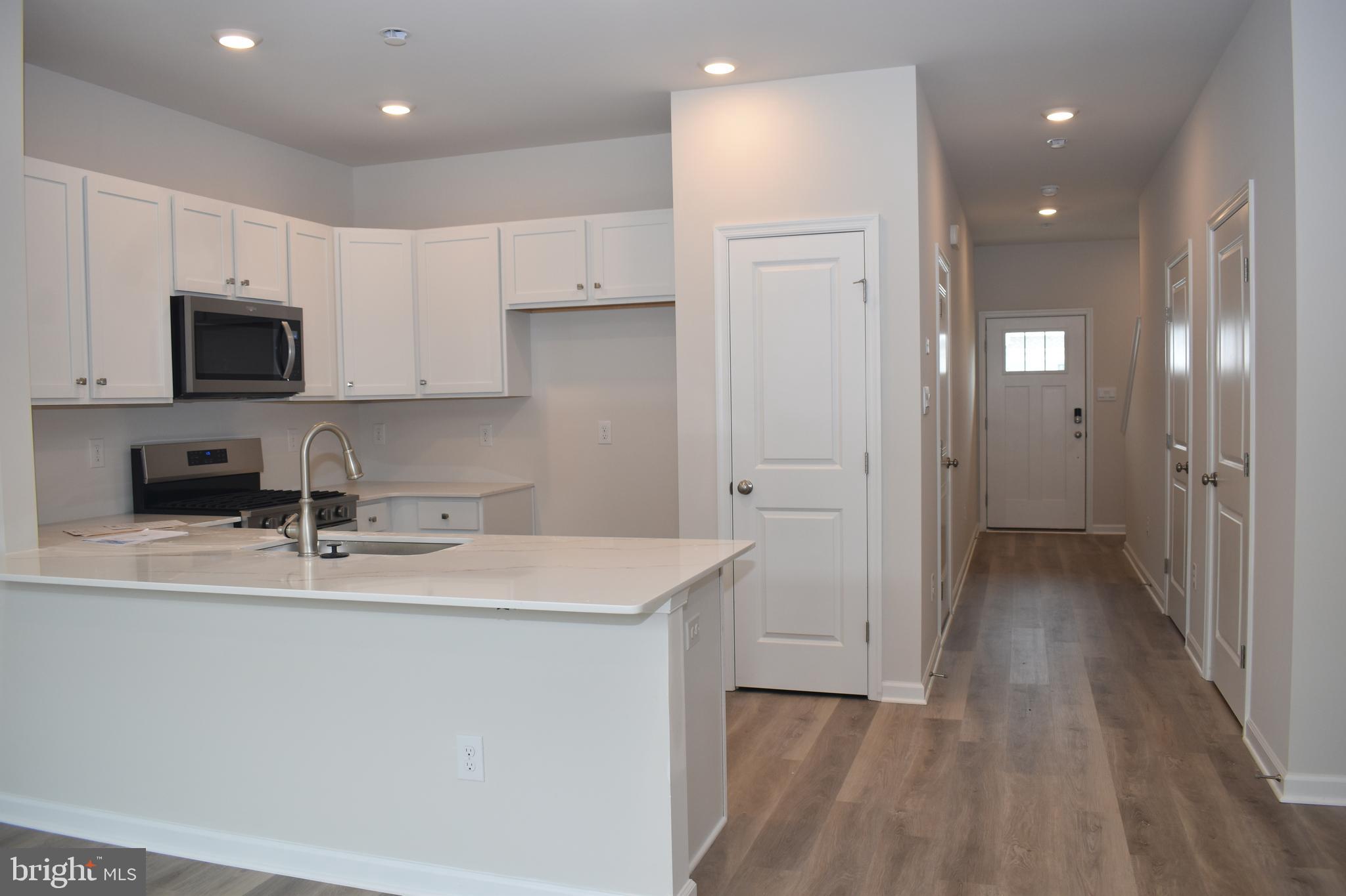 80 Alexander Way Westampton, NJ 08060 - Photo 26 of 45 a kitchen with a sink a refrigerator and cabinets