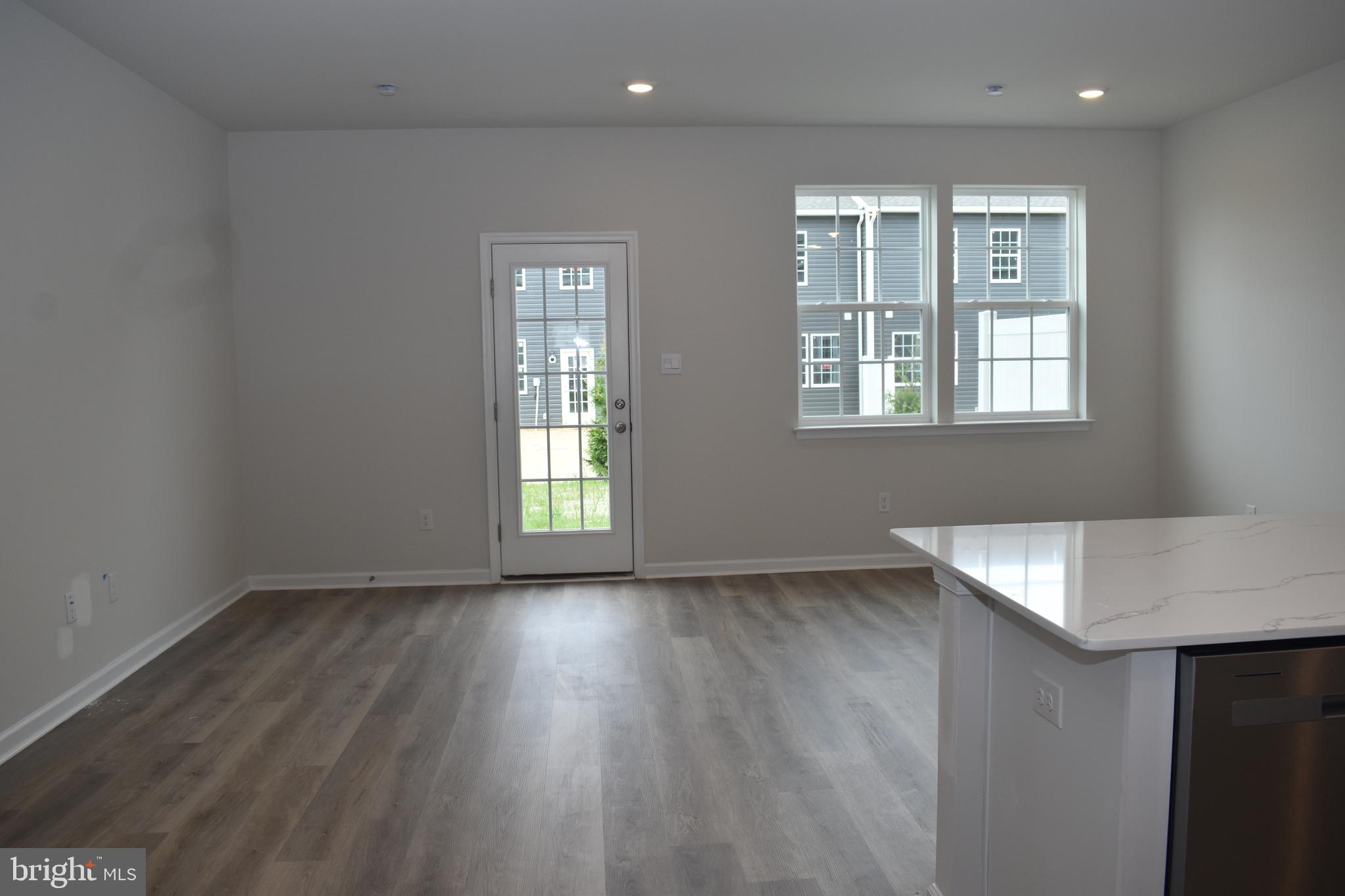 80 Alexander Way Westampton, NJ 08060 - Photo 27 of 45 an empty room with wooden floor and windows