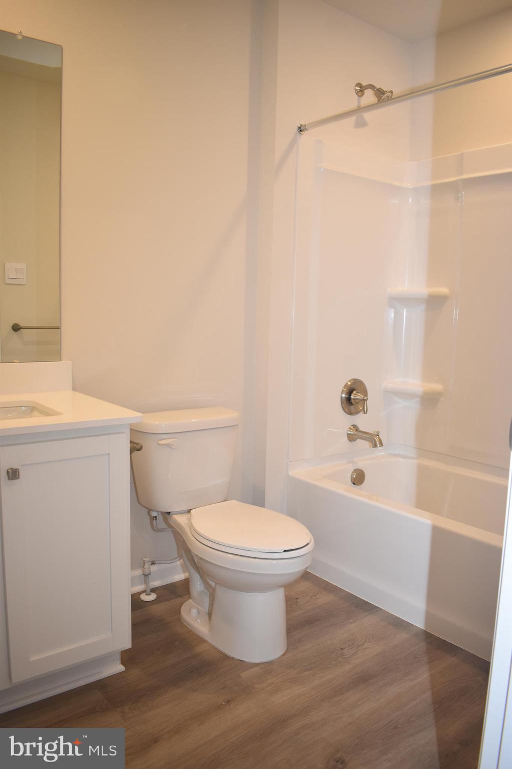 80 Alexander Way Westampton, NJ 08060 - Photo 29 of 45 a white toilet sitting next to a bath tub