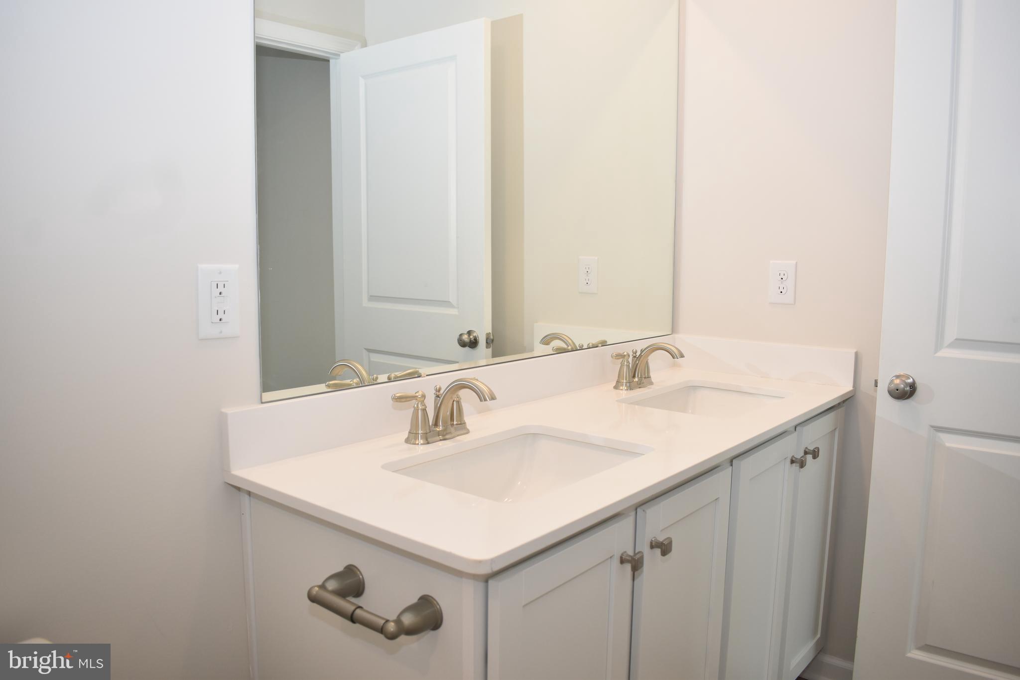 80 Alexander Way Westampton, NJ 08060 - Photo 35 of 45 a bathroom with a sink and a mirror