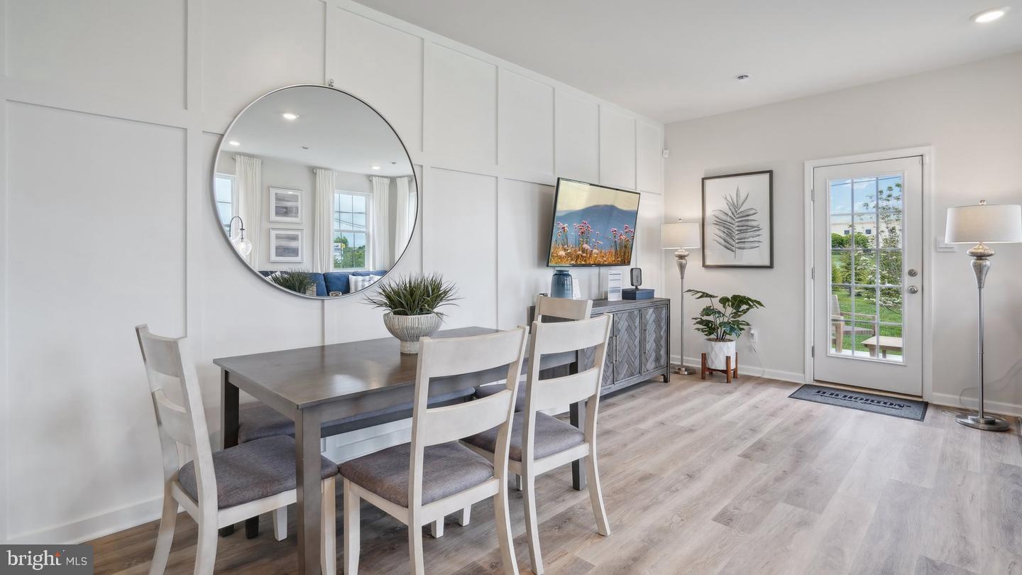 80 Alexander Way Westampton, NJ 08060 - Photo 4 of 45 a dining room with furniture potted plants and wooden floor