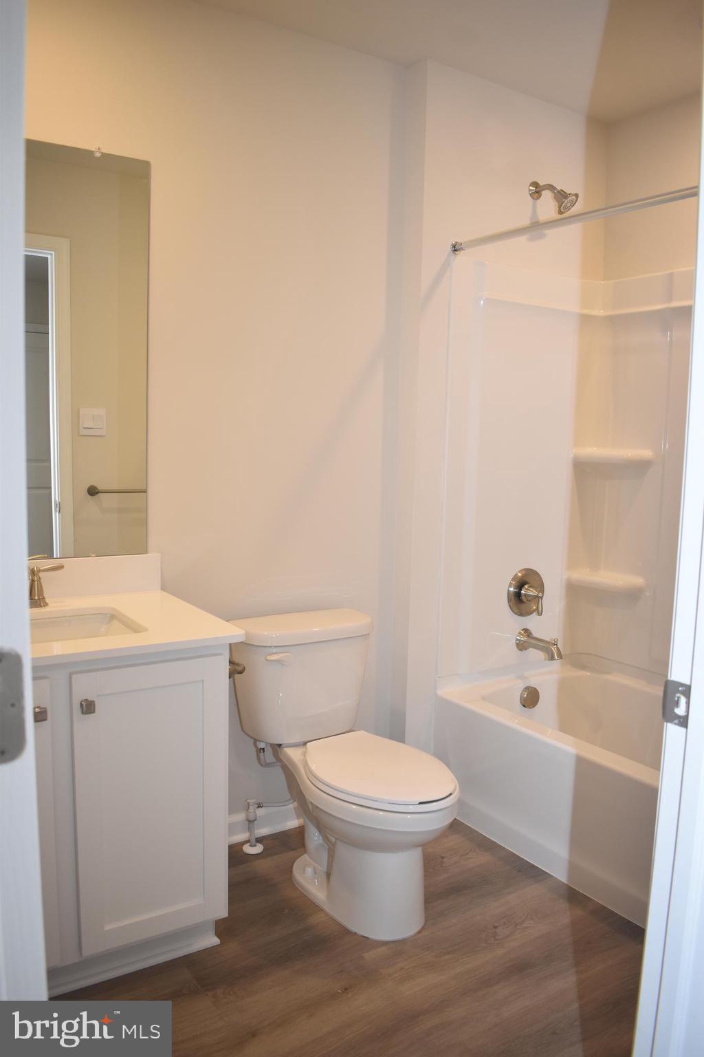 80 Alexander Way Westampton, NJ 08060 - Photo 41 of 45 a white toilet sitting next to a bath tub
