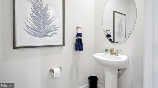 a bathroom with a sink and mirror