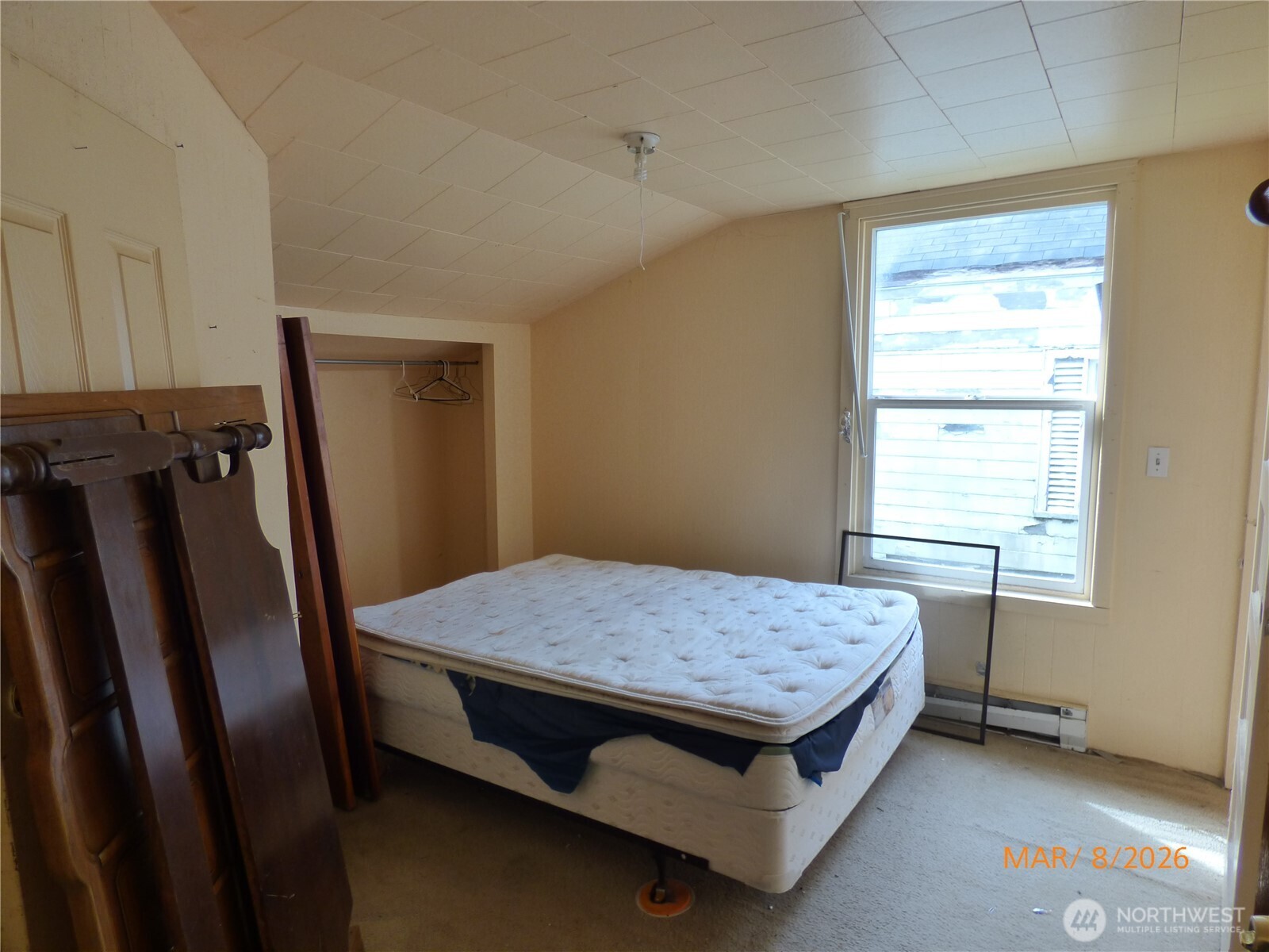 1801 West Second Street Aberdeen, WA 98520 - Photo 12 of 16 a bed sitting in a room next to a window