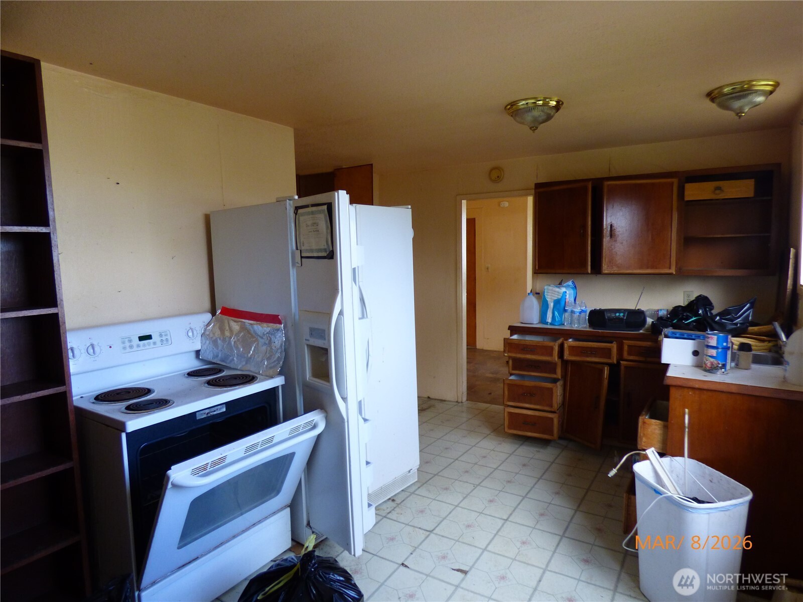 1801 West Second Street Aberdeen, WA 98520 - Photo 5 of 16 a kitchen with stainless steel appliances a stove refrigerator sink and cabinets