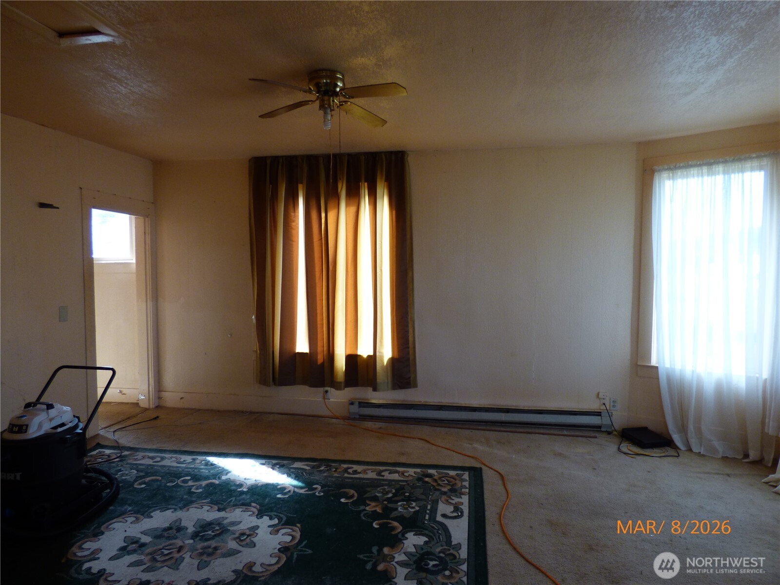 1801 West Second Street Aberdeen, WA 98520 - Photo 9 of 16 a view of an empty room with window and wooden floor