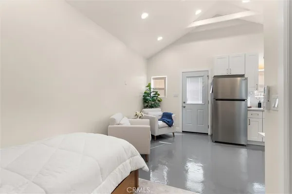 a kitchen with stainless steel appliances a refrigerator stove and microwave
