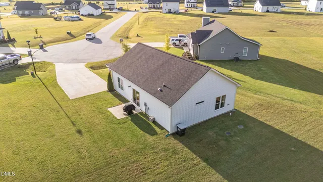 a view of a swimming pool with a yard