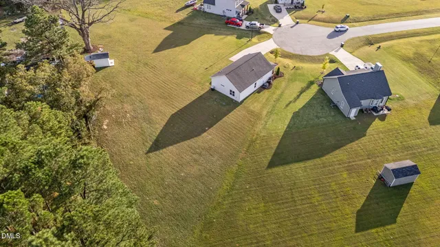 an aerial view of a house with a ocean view