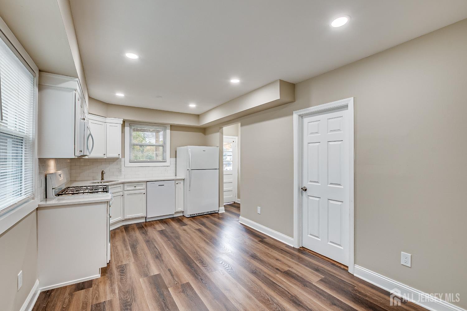 93 Player Avenue Edison, NJ 08817 - Photo 13 of 29 a view of a kitchen with wooden floor a sink and windows