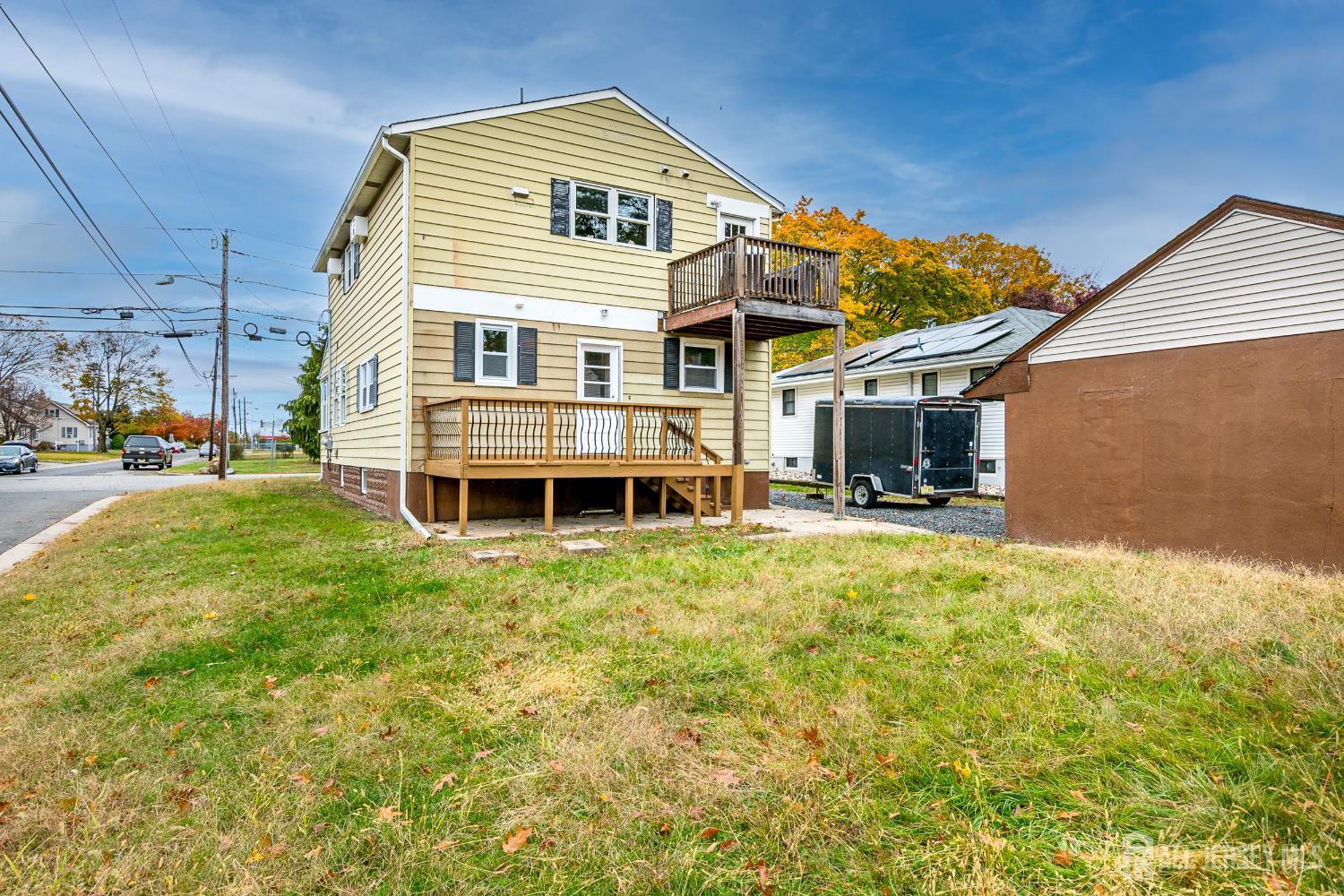 93 Player Avenue Edison, NJ 08817 - Photo 20 of 29 a front view of a house with a yard