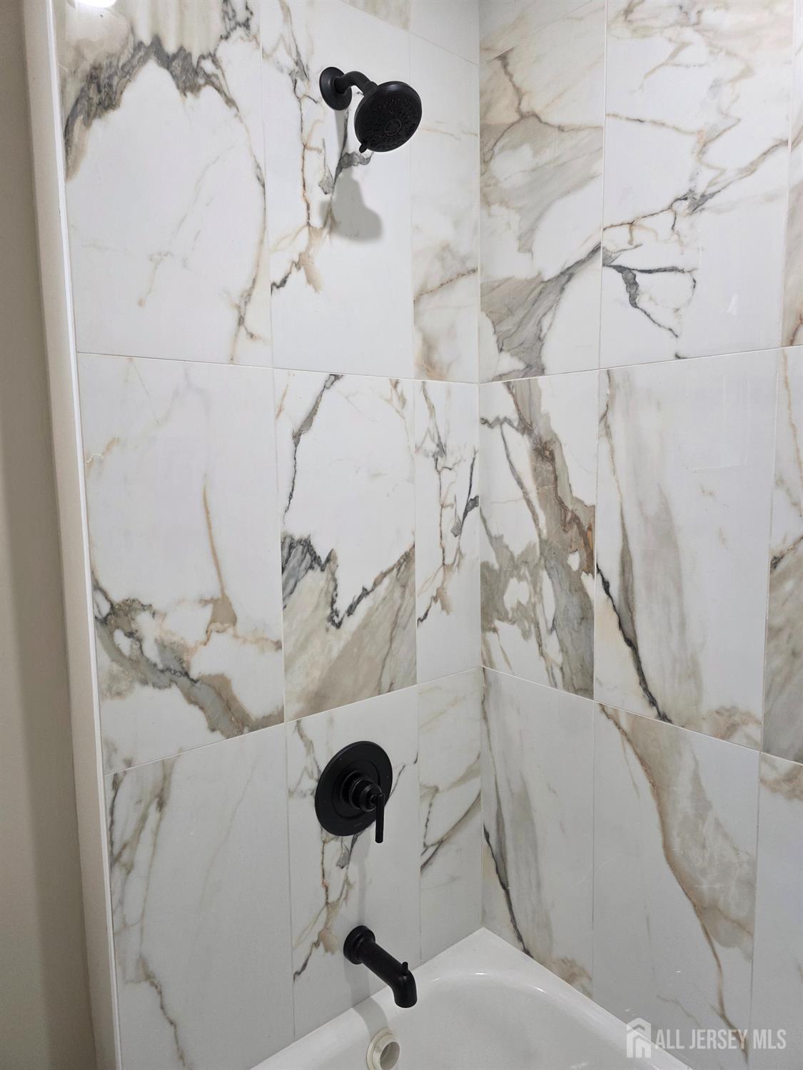 93 Player Avenue Edison, NJ 08817 - Photo 22 of 29 a view of a chandelier in a bathroom